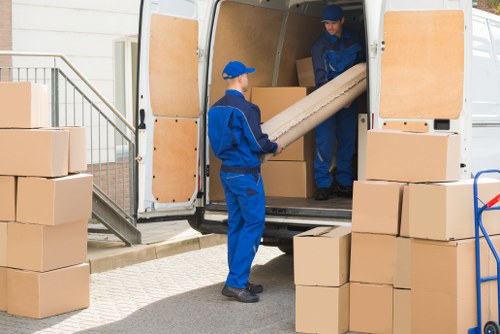 Removal team sorting recyclable items during a Ruislip house move