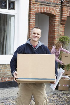 Removal team handling furniture safely during a move in Ruislip