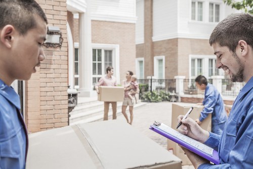 House movers loading furniture in a Ruislip residential street