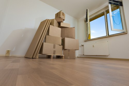 Business relocation team transporting office furniture safely in Ruislip