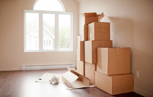 Removal company team using safety procedures during loading