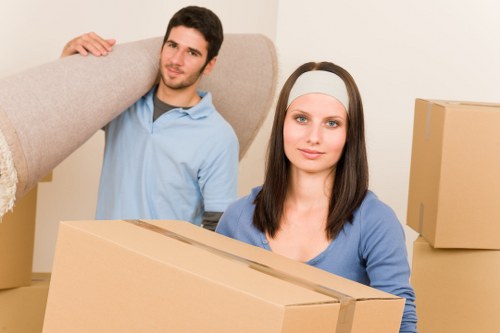 Local moving team arranging items inside a removal van