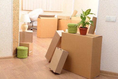 Professional movers handling furniture in a Ruislip property
