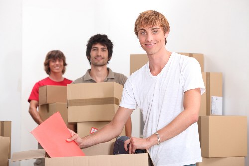 Preparing boxes and furniture for a moving truck in Ruislip