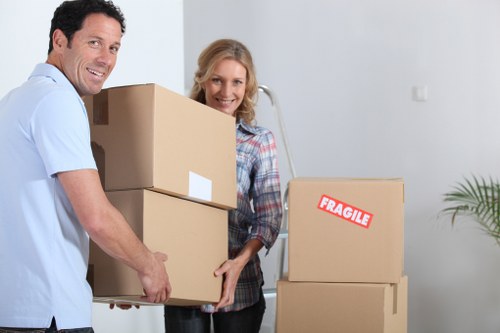 Removalists carrying furniture from a family home in Ruislip